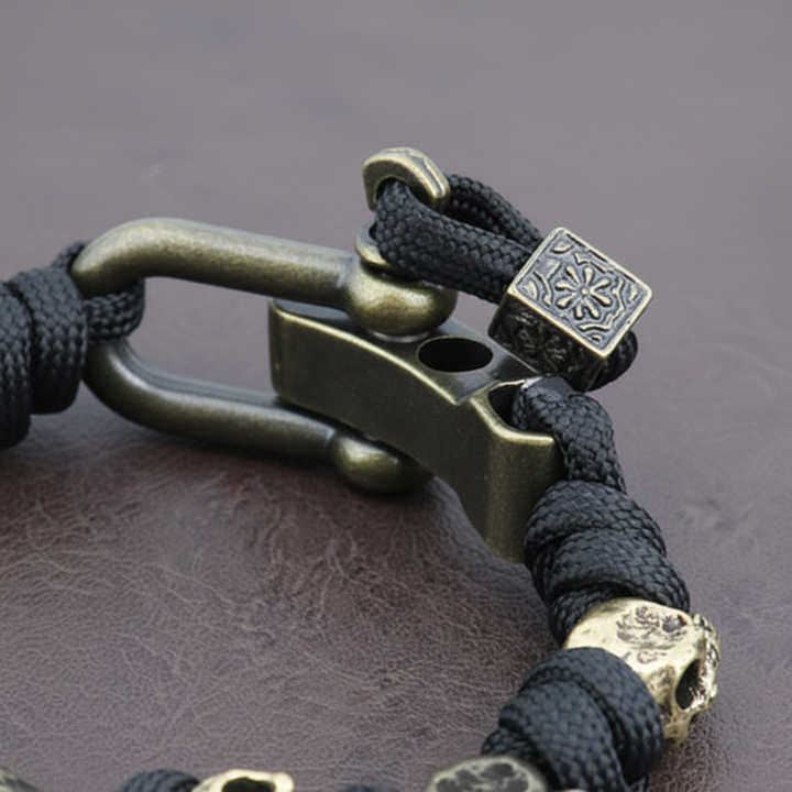 Braccialetto paracord da uomo con teschi in metallo bronzato