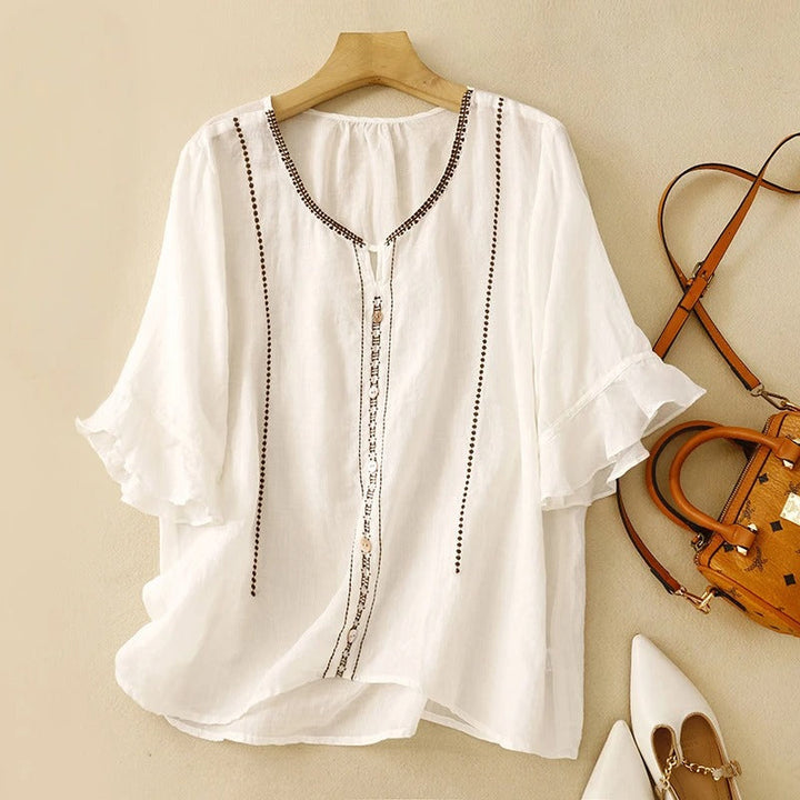 Blusa con maniche a volant e motivo