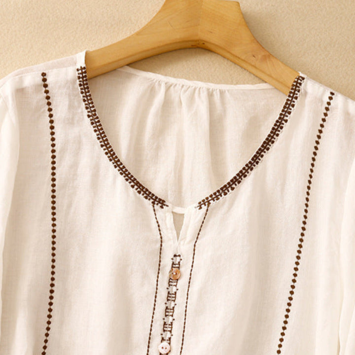 Blusa con maniche a volant e motivo