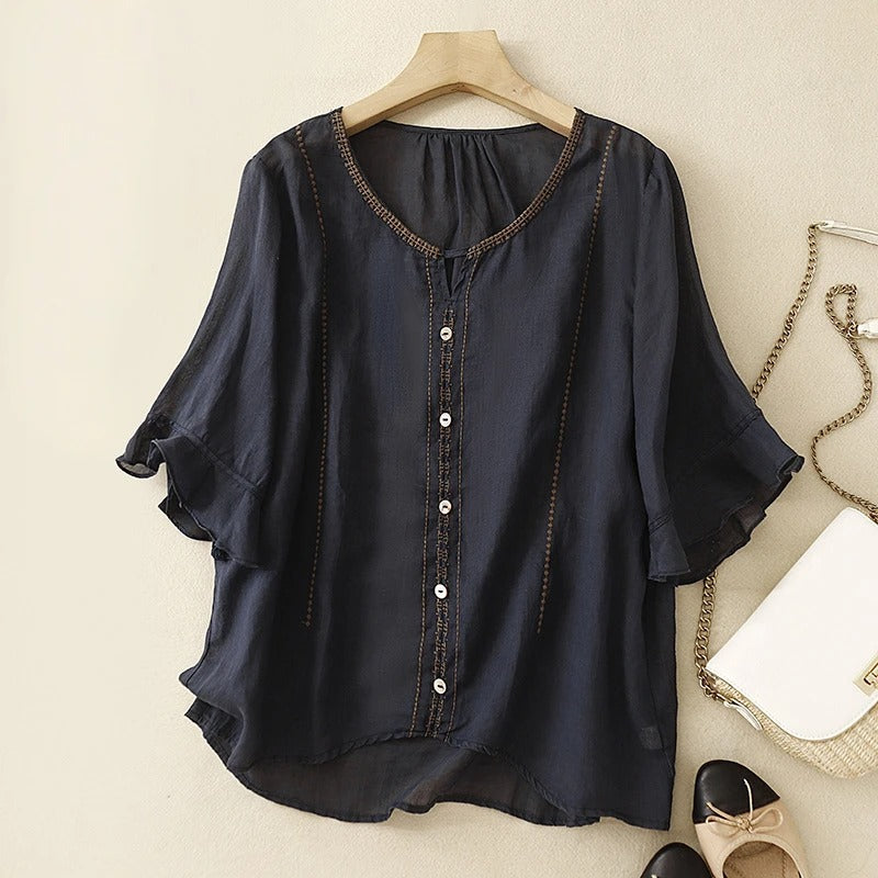 Blusa con maniche a volant e motivo