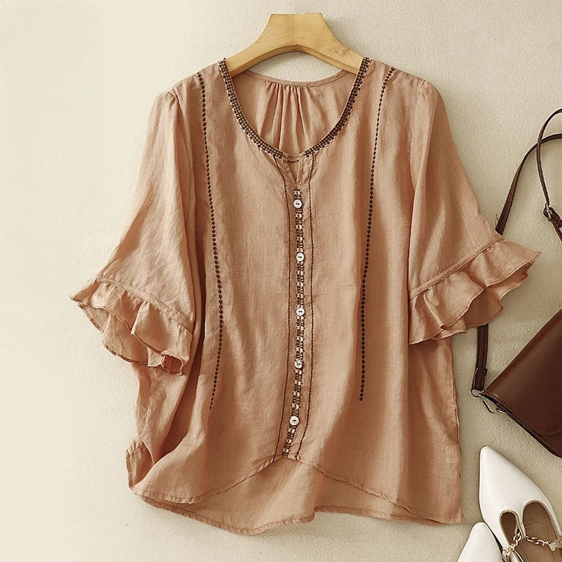 Blusa con maniche a volant e motivo