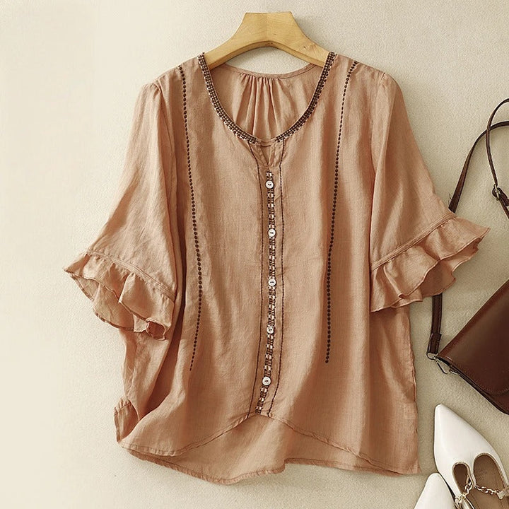 Blusa con maniche a volant e motivo