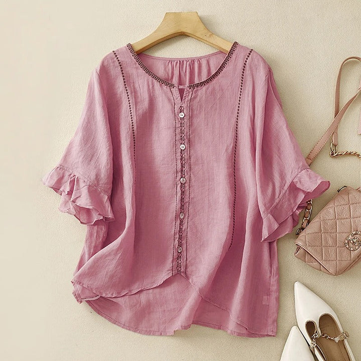 Blusa con maniche a volant e motivo