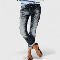 Jeans da donna a gamba larga con effetto usurato