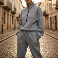 Tuta sportiva da donna con mezza zip