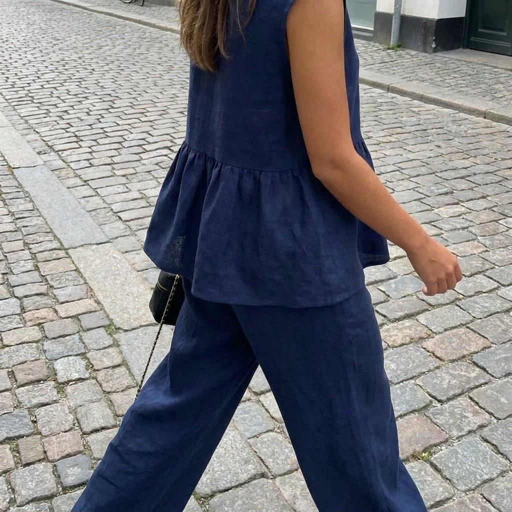 Completo donna con top senza maniche con volant e pantaloni larghi  